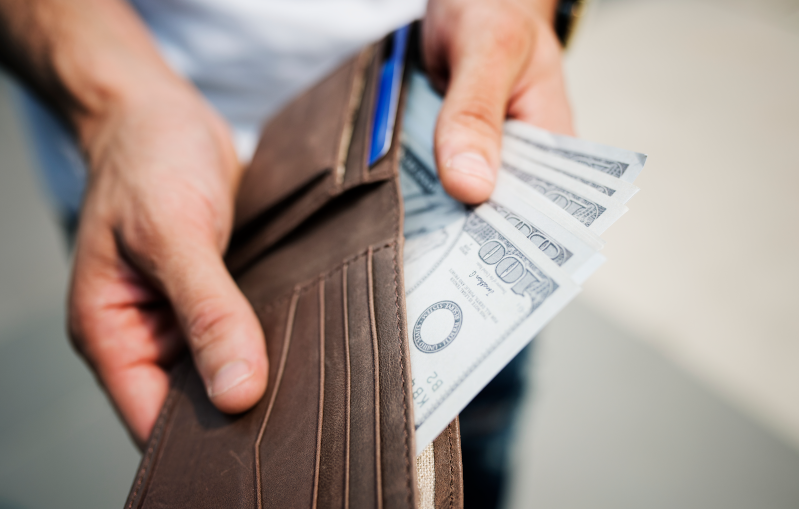 cash in a wallet due to good spending habits