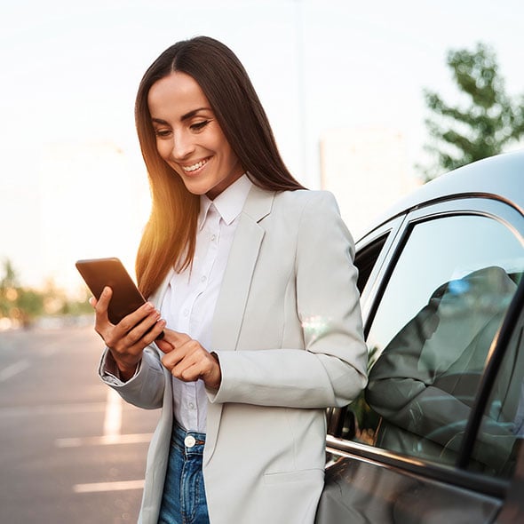 Business woman with her new business vehicle.