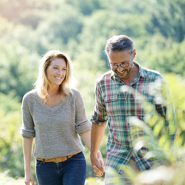 Happy couple walking who have set up their Certificate of Deposit Savings Account to grow their wealth.