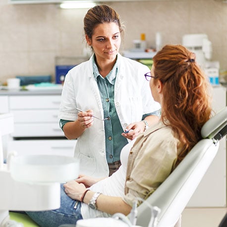 Dentist applying for a PCU Physicians loan through her local credit union in Portland Oregon