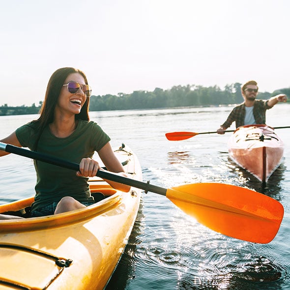 People kayaking who have peace of mind with a personal line of credit from Providence Credit Union PCU in portland oregon.