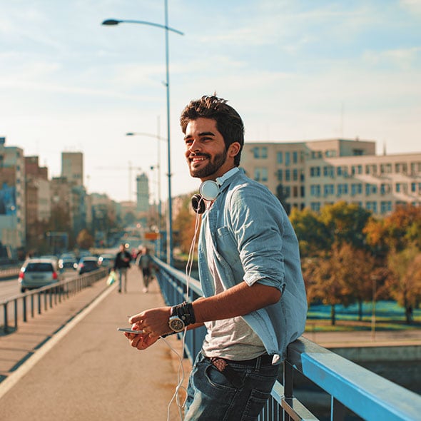 Man in a city who is building his credit with a Share Secured Loan from PCU credit union in Portland Oregon.