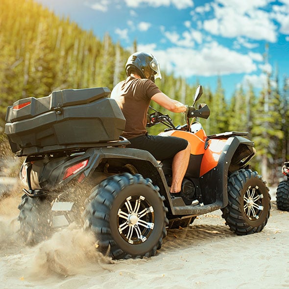 Quad riders on a new ATV purchased with an ATV loan in Portland Oregon.