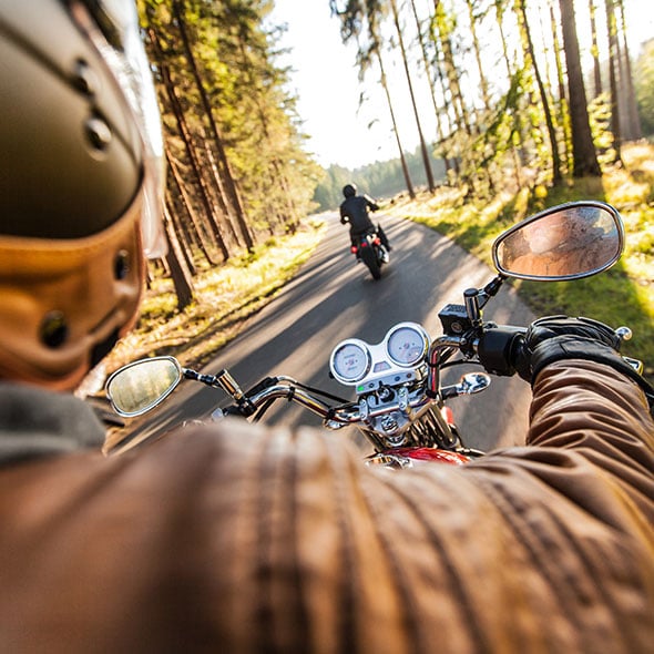 Riding a new motorcycle in the forest in Portland Oregon.