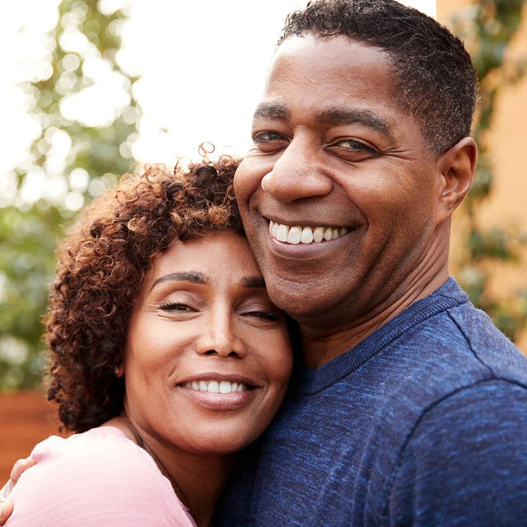 Smiling couple who are saving for retirement with a IRA from PCU Credit union in Portland Oregon.