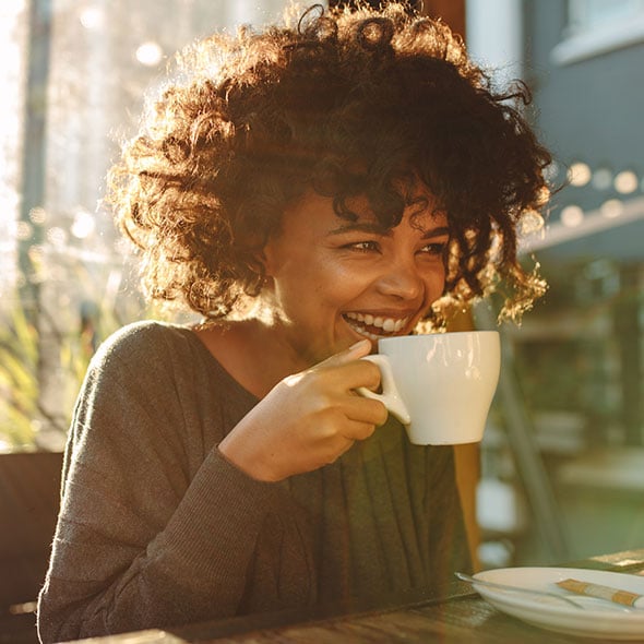 Happy smiling woman who has a personal line of credit from CCCU.