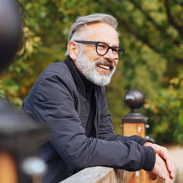 Man smiling on bridge in Portland Oregon.