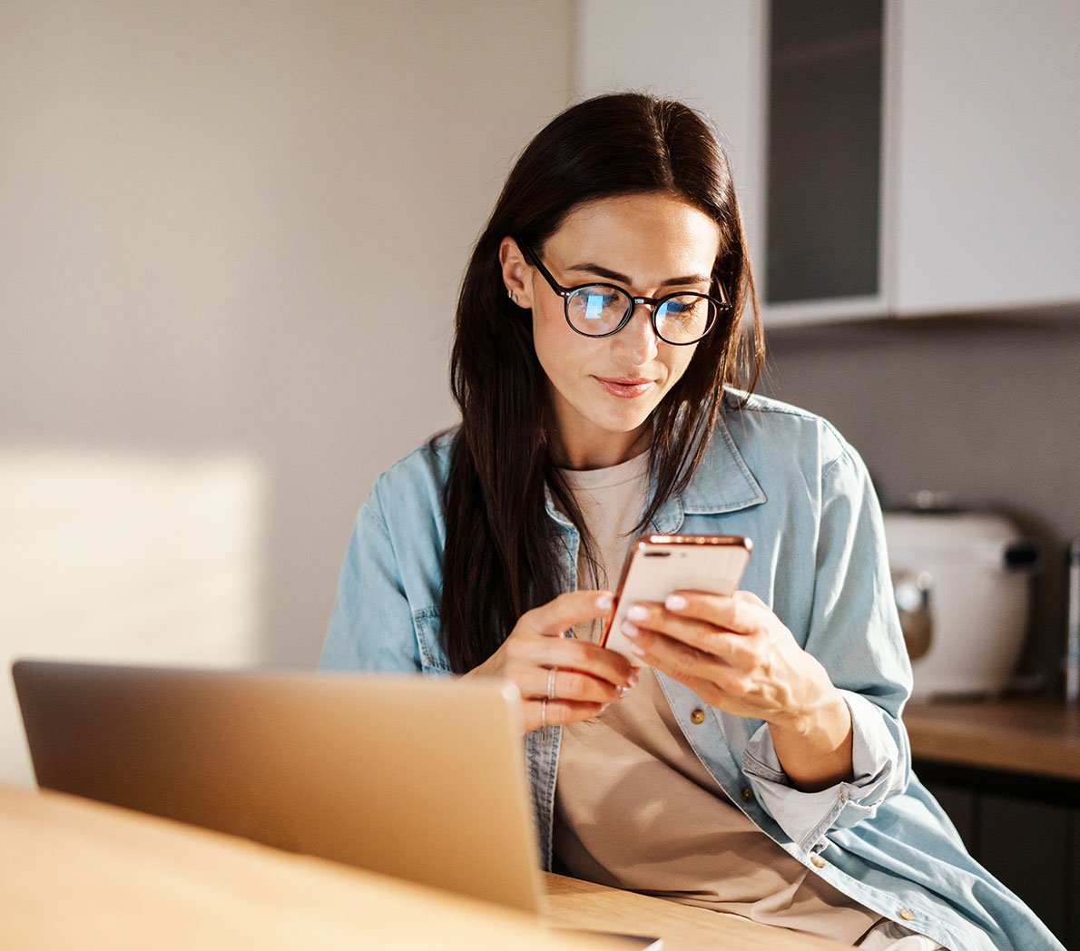 Woman managing her PCU Debit Card with the Card Controls App