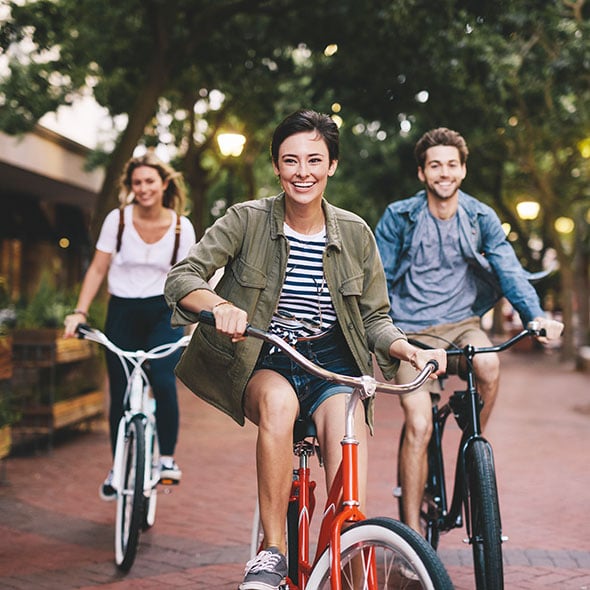 Friends riding their bikes purchased with a bicycle loan from Consolidated Community Credit Union CCCU in Portland Oregon.