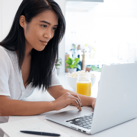 woman reviewing her PCU estatement on her laptop-min