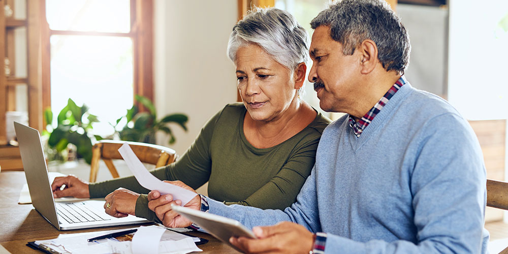 Couple working together on their taxes.